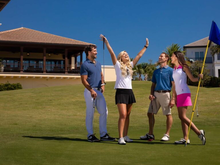 Couples cheering during a golf game on the Jack Nicklaus Signature Course